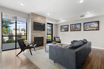 Clubhouse with lounge area, fireplace, tv, games, and kitchen